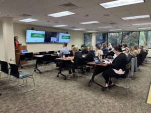 October 2023 HR Forum - Group of Attendees Listening to Speaker
